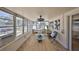 Bright sunroom with lots of natural light, comfortable seating, and views of the backyard at 7491 Cedar Ne St, St Petersburg, FL 33702