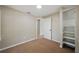 Bedroom with neutral paint, carpet, and closet with shelving at 8215 N 12Th St, Tampa, FL 33604