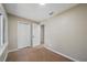 Bedroom featuring neutral walls and carpet with a closet for storage at 8215 N 12Th St, Tampa, FL 33604