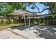 Metal carport structure in the backyard, providing covered parking at 8215 N 12Th St, Tampa, FL 33604