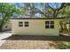 Exterior view of the home with double-pane windows on a sunny day at 8215 N 12Th St, Tampa, FL 33604