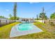 Charming backyard features an in-ground pool with manicured lawn and a detached home at 8409 Lantana Dr, Seminole, FL 33777