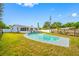 Home exterior featuring screened in patio and pool at 8409 Lantana Dr, Seminole, FL 33777