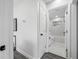 Hallway view into a sleek bathroom featuring a modern shower and vanity at 8409 Lantana Dr, Seminole, FL 33777