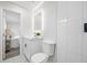 Well-lit bathroom featuring an LED mirror, white vanity, and modern fixtures at 8409 Lantana Dr, Seminole, FL 33777
