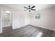 Bedroom with gray wood-look flooring and ceiling fan at 8409 Lantana Dr, Seminole, FL 33777