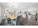 Open floor plan featuring the dining room with a view of the renovated kitchen and living room at 8409 Lantana Dr, Seminole, FL 33777