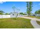 Exterior view of the home and surrounding neighborhood, highlighting the well-manicured lawn at 8409 Lantana Dr, Seminole, FL 33777