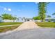 Charming one story home with a long driveway, blue paint, and well-kept lawn at 8409 Lantana Dr, Seminole, FL 33777