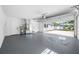 Spacious garage with white walls and painted floor for parking and storage at 8409 Lantana Dr, Seminole, FL 33777