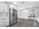 Bright updated kitchen with stainless appliances and a view to bonus storage at 8409 Lantana Dr, Seminole, FL 33777