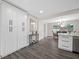 Updated kitchen with a breakfast bar and storage, flowing into the dining area at 8409 Lantana Dr, Seminole, FL 33777