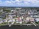 Canal front home with a swimming pool, private dock, and lush landscaping at 8722 Hickorywood Ln, Tampa, FL 33615