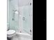 Modern bathroom featuring a glass shower with white subway tile and a rainfall showerhead at 8722 Hickorywood Ln, Tampa, FL 33615