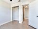 Bedroom with light hardwood floors, closet, and neutral walls at 8722 Hickorywood Ln, Tampa, FL 33615