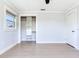 Bedroom featuring a closet with built-in shelving and light hardwood floors at 8722 Hickorywood Ln, Tampa, FL 33615