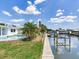 A beautiful waterfront property featuring a well-manicured lawn, and private canal access at 8722 Hickorywood Ln, Tampa, FL 33615