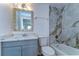 Bathroom showcases quartz countertop, tiled shower/tub combo and modern fixtures at 911 Kirkcaldy Way, Valrico, FL 33594