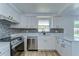 Remodeled kitchen featuring stainless steel appliances and stone countertops at 911 Kirkcaldy Way, Valrico, FL 33594