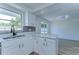 Kitchen with stone countertops and new white cabinets at 911 Kirkcaldy Way, Valrico, FL 33594