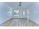 Open floor plan with wood flooring and new front door at 911 Kirkcaldy Way, Valrico, FL 33594