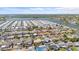 Wide aerial shot showcases the beautiful community with waterfront access and lush greenery at 3748 Redwood Dr, Holiday, FL 34691
