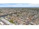 Expansive aerial view of a vibrant residential community, featuring numerous homes and waterways at 3748 Redwood Dr, Holiday, FL 34691