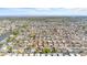 Bird's eye view captures a large neighborhood, highlighting the numerous homes and street layout at 3748 Redwood Dr, Holiday, FL 34691