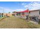 Spacious backyard boasts a fenced perimeter and shaded areas at 3748 Redwood Dr, Holiday, FL 34691