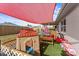 Playful backyard features playhouse and artificial turf at 3748 Redwood Dr, Holiday, FL 34691