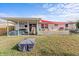 The fenced backyard includes a covered patio and play area at 3748 Redwood Dr, Holiday, FL 34691