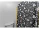 A charming bathroom featuring a walk-in shower with a spooky Halloween themed shower curtain at 3748 Redwood Dr, Holiday, FL 34691