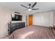 This bedroom includes a closet, fan, and dresser at 3748 Redwood Dr, Holiday, FL 34691