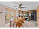 Charming dining room featuring hardwood floors, modern lighting, and a delightful eating area at 3748 Redwood Dr, Holiday, FL 34691