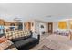 Bright and welcoming living room boasting hardwood flooring, lots of natural light, and an open concept floor plan at 3748 Redwood Dr, Holiday, FL 34691