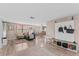 Comfortable living room with hardwood flooring, lots of natural light and an open concept floor plan at 3748 Redwood Dr, Holiday, FL 34691