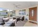 Inviting screened porch with seating area and ceiling fan, perfect for relaxation at 3748 Redwood Dr, Holiday, FL 34691