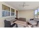 Inviting screened porch with outdoor furniture and natural light, perfect for relaxing at 3748 Redwood Dr, Holiday, FL 34691