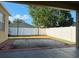 View from covered patio to backyard with white fence and landscape at 11318 Laurel Brook Ct, Riverview, FL 33569