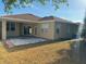Back of house featuring landscaped yard, patio and lush green grass at 11318 Laurel Brook Ct, Riverview, FL 33569