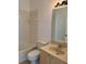 Standard bathroom featuring tub, commode and single sink vanity with mirror at 11318 Laurel Brook Ct, Riverview, FL 33569