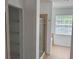 Well-lit bathroom featuring a glass shower, a large window, and beige tile flooring at 11318 Laurel Brook Ct, Riverview, FL 33569