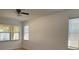 Well-lit bedroom featuring neutral carpet, freshly painted walls and natural light from two windows at 11318 Laurel Brook Ct, Riverview, FL 33569