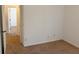 Bedroom featuring carpet flooring and natural light from the hallway entrance at 11318 Laurel Brook Ct, Riverview, FL 33569