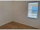 Bedroom featuring carpet flooring, white walls, and a bright window at 11318 Laurel Brook Ct, Riverview, FL 33569