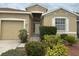 A close up of the front door and landscaping of the single-Gathering home at 11318 Laurel Brook Ct, Riverview, FL 33569