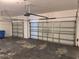 A spacious two-car garage, featuring white doors and a functional design at 11318 Laurel Brook Ct, Riverview, FL 33569