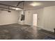 Spacious garage featuring a door, ceiling, and large empty area at 11318 Laurel Brook Ct, Riverview, FL 33569