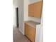 Hallway featuring cabinets with countertop, providing extra storage and utility at 11318 Laurel Brook Ct, Riverview, FL 33569