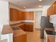 Well-lit kitchen with wood cabinets, stainless steel appliances, and tile flooring at 11318 Laurel Brook Ct, Riverview, FL 33569